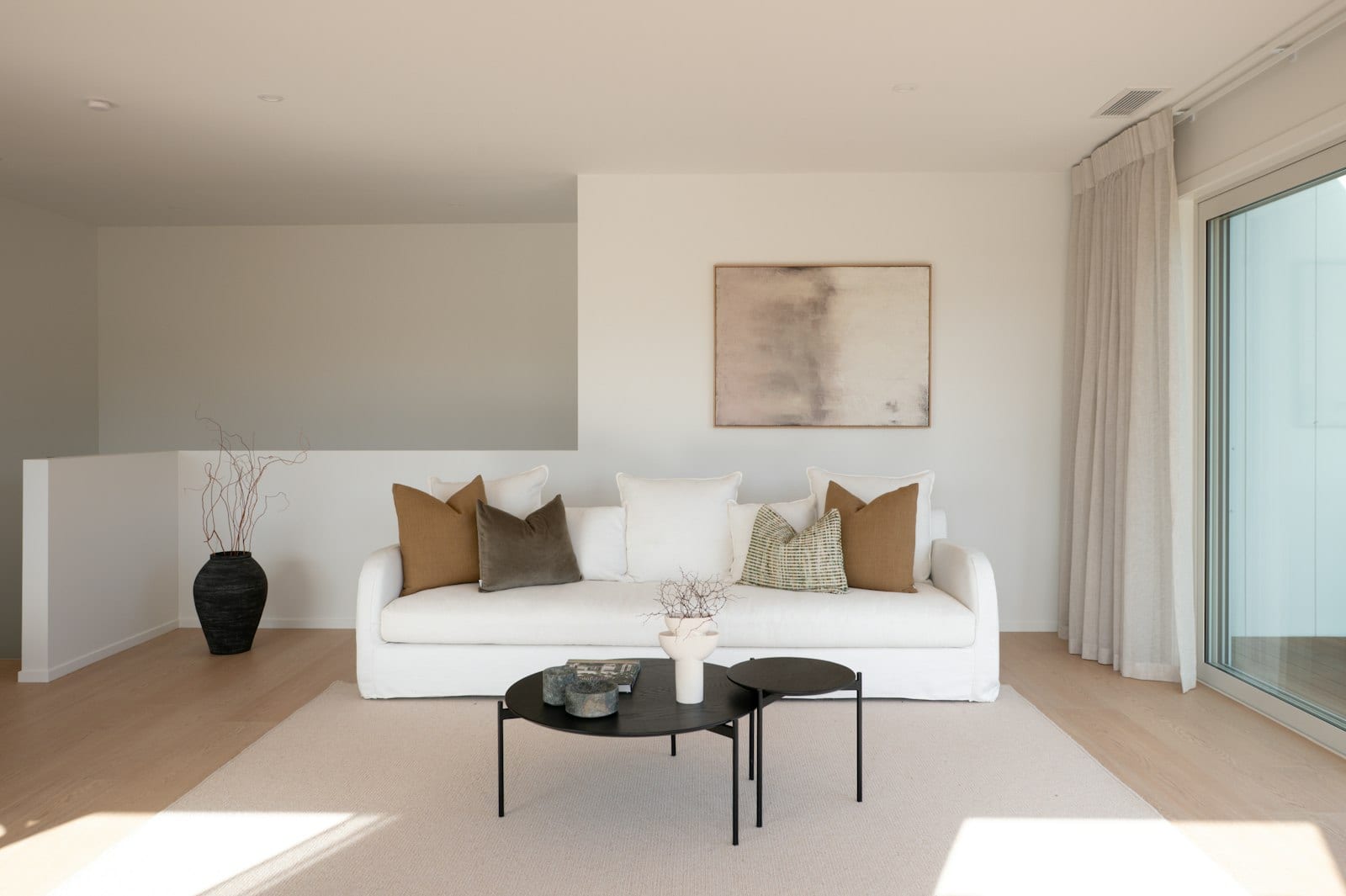 Light-filled living room opening to the outdoors in a Signature Homes build