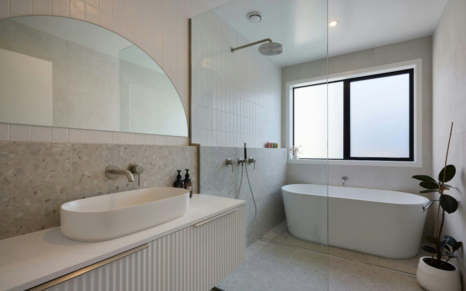 Family bathroom with freestanding bath, walk-in shower and terrazzo tiling in a Signature Homes build