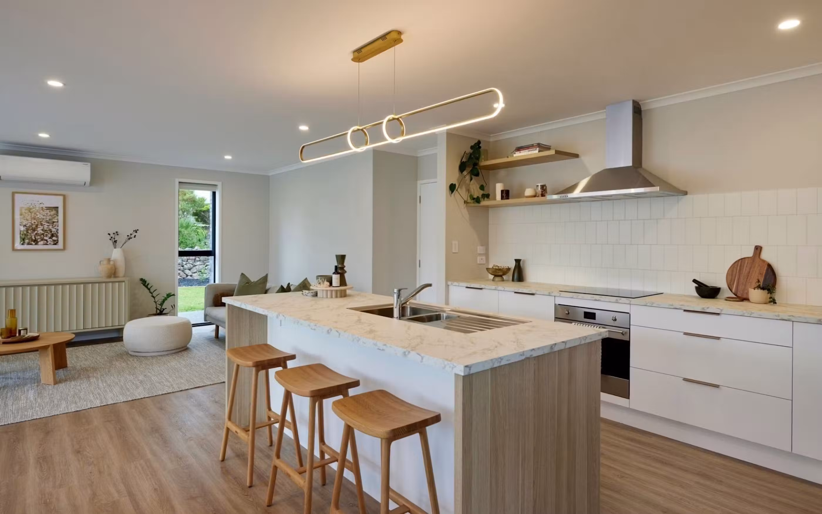 Open-plan kitchen with island bench, pendant lighting in a Signature Homes build