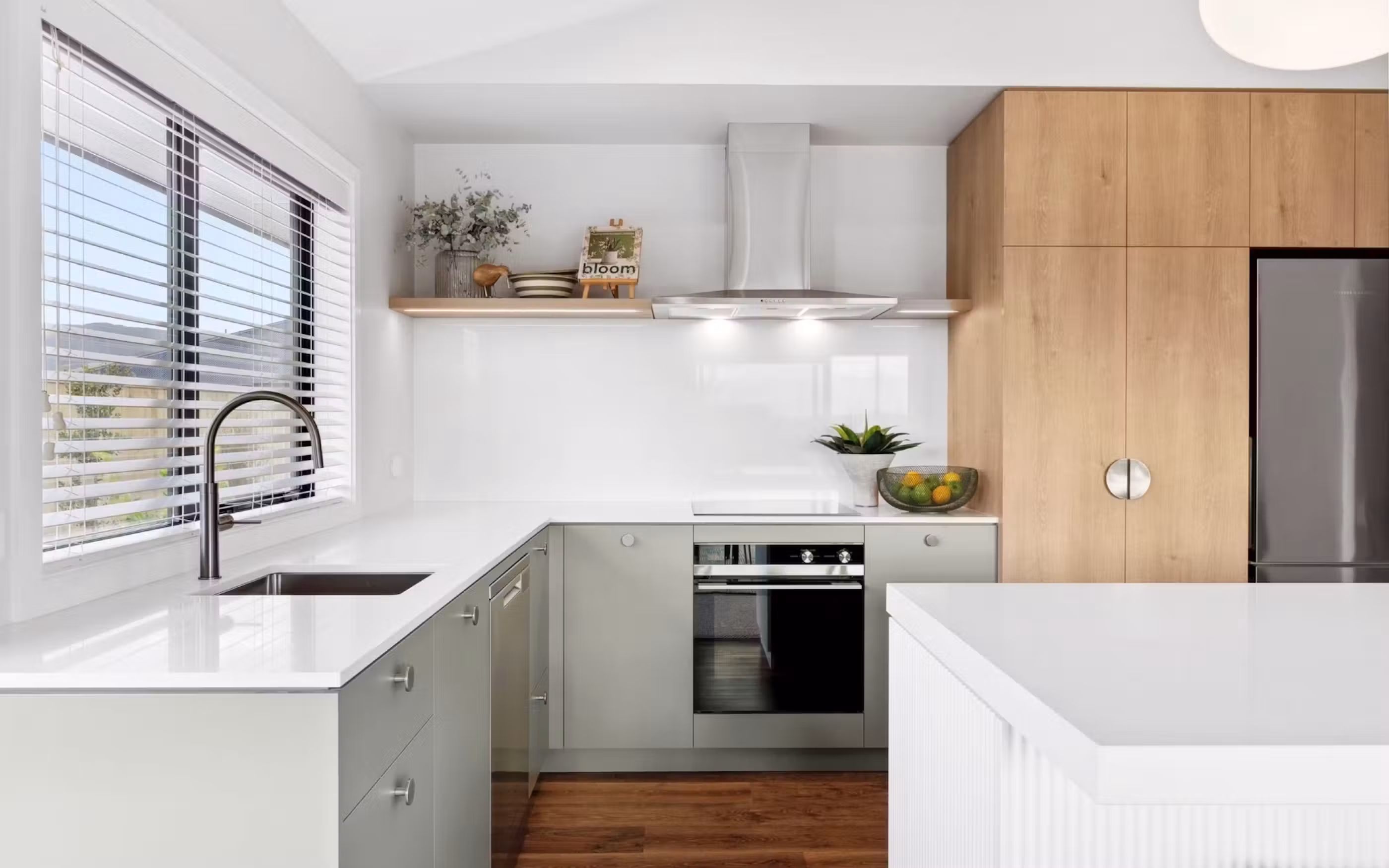A bright, beautifully finished kitchen where natural timber tones meet fresh, contemporary design.