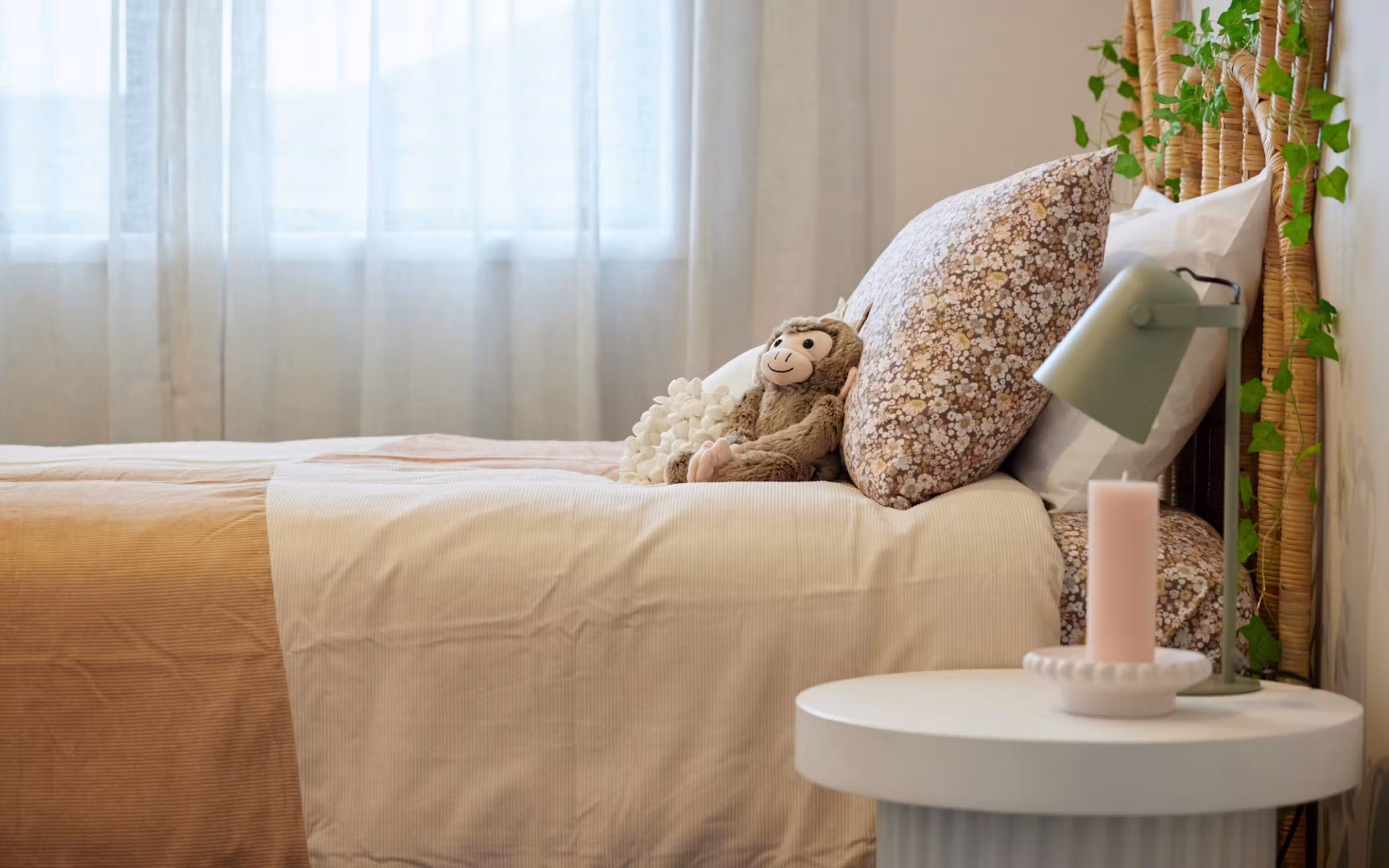 A welcoming bedroom combining soft textures, natural materials and plenty of natural light.